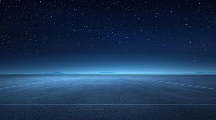 Obraz premium Spacious empty asphalt floor under a starry night sky.