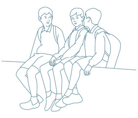  School friends talking while sitting together