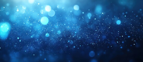Fototapeta premium Abstract Blue Sparkle Background: Shimmering Lights and Glowing Dust