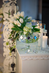 Sophisticated White Tulip Display with Candle Accents