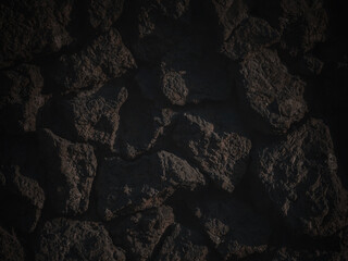 Rough granite stones. The texture of the stone wall. Dark background for design. Shaded vintage texture with vignette.