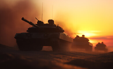 Military Tanks Advancing Through Dusty Terrain At Sunset With Dramatic Lighting
