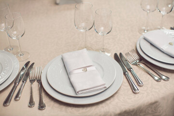 Sophisticated Dining Table Arrangement With Fine Tableware And Crystal Glasses