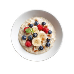 A nourishing bowl of creamy oatmeal is topped with fresh blueberries, raspberries, banana slices, and almond slivers against a clean white background for breakfast.