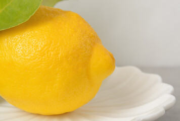 Whole lemon on a light plate