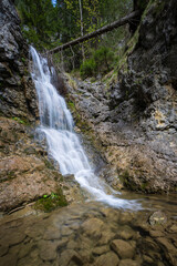 Naklejka premium Forest waterfall on the river Borovianka, flowing through Kvacianska valley.