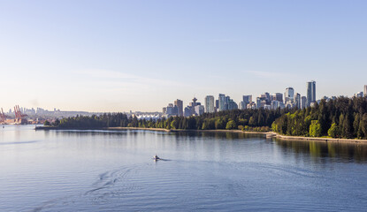 Scenic View of Downtown Vancouver Skyline and Stanley Park Across the Water
