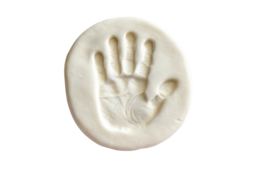 PNG Imprint of a child's hand in white clay disc