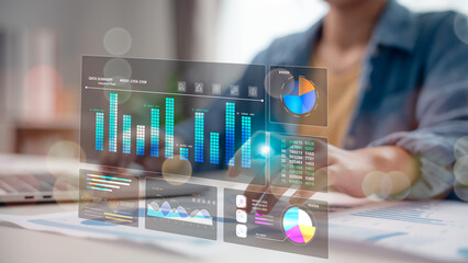 Businessperson analyzing interactive digital dashboard with bar charts, pie graphs, and data visualizations, representing performance tracking, financial reports, and smart analytics.