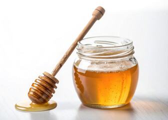 Golden Honey Jar with Dipper on White Background

