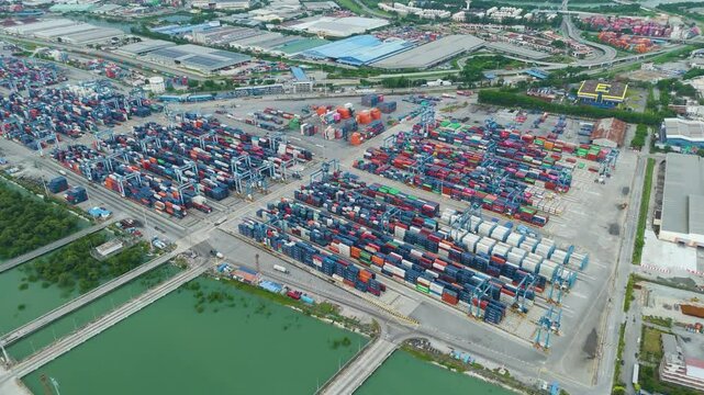Aerial panorama of Northport container depot in Klang, Malaysia, displaying expansive logistics operations, cargo stacking, and global shipping infrastructure. UHD.