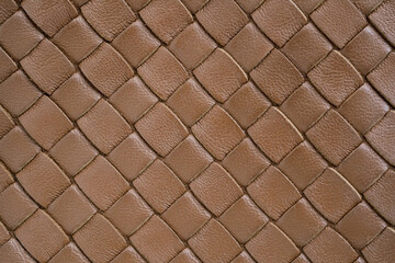 Closeup of Intrecciato leather  (braided leather) texture background 