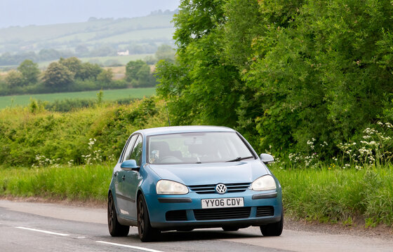 Upper Winchendon,Bucks,UK - May 18th 2025:  2006 blue Volkswagen Golf  car driving in the British countryside.