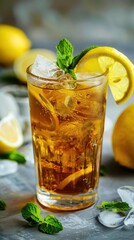 Refreshing iced lemon tea cocktail garnished with fresh mint and lemon slices