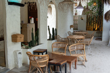 Serene Patio Cafe: Rattan Chairs and White Walls