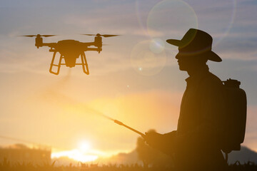 Farmer with fertilizer drone sunset time