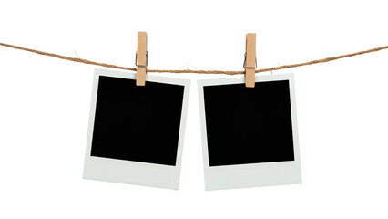 Two blank Polaroid photo frames clipped to a rope with wooden pegs, isolated on transparent background, perfect for nostalgia-themed designs, scrapbooks, or memory placeholders.