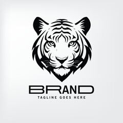 Tiger head logo design in black and white with a modern font for branding. Stylish graphic for use in promotional material or company identity.