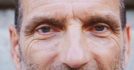 Closeup, mature man and portrait with eyes for wellness, awareness and optometry for vision test. Healthcare, eyelash and male person with optical wellbeing for contact lenses, sight and perception