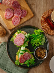 smoked sausage on a board with herbs