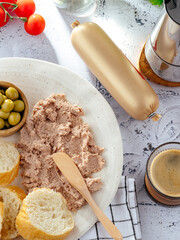 pate with bread and olives on a plate