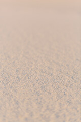 Soft textured gypsum sand at sunset in White Sands, New Mexico.