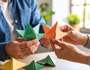 Colorful origami creations held by two individuals, a captivating display of paper art