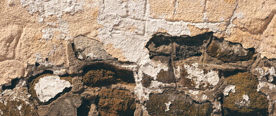 Old Weathered Wall With Crumbling Plaster And Exposed Stones Textured Surface Front View Earthy Tones
