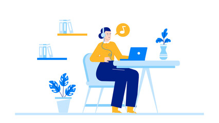 Young woman working at desk with laptop and headphones, enjoying music