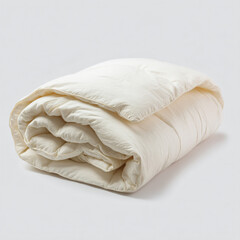 Obraz premium a white blanket folded up on a white surface