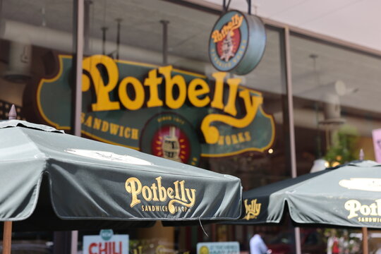 Potbelly logo on a patio umbrella of a Potbelly restaurant near White House in Washington DC