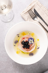 A traditional dish in Peru, ceviche, elegant appetizer of fresh fish in lime sauce leche de tigre, black caviar