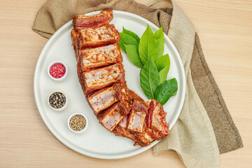 Marinated raw ribs with spices and herbs. Traditional ingredient for BBQ, picnic concept