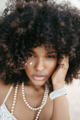 Afro Style Portrait of a Confident Fashionista Laughing with Glamour and Attitude. Smiling.