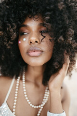 Afro Style Portrait of a Confident Fashionista Laughing with Glamour and Attitude. Smiling.