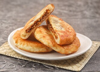 Hotteok is a pancake filled with bean paste, sold as a South Korean street food.