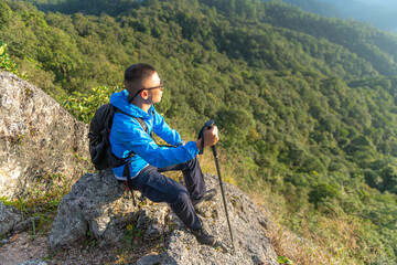 Men traveling with a backpack, hiking in the mountains, travel, travel, lifestyle, success, motivation, adventure concepts, outdoor vacations and sports.