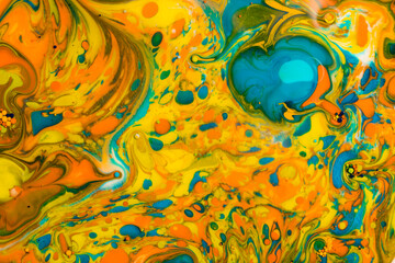 Swirls of liquid ink create vibrant summer hues in an abstract pattern