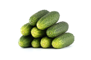Neatly arranged pyramid of fresh, vibrant green cucumbers against a clean white backdrop.