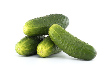 Group of fresh, green cucumbers piled together on a clean, white background.