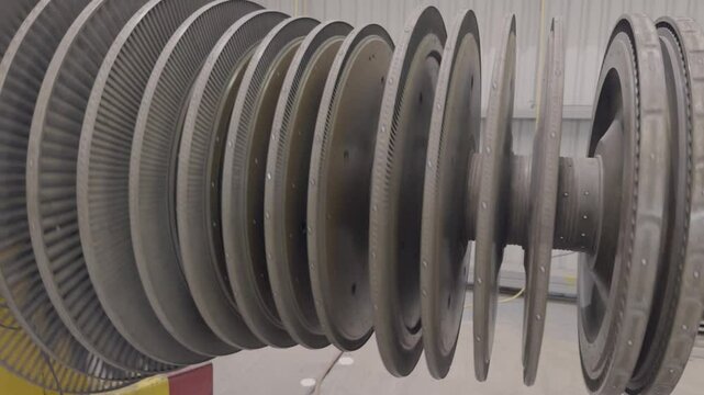 A steam turbine spinning in the open