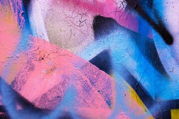 Abstract neon graffiti texture in iridescent blue, pink, black. Urban 90s style, crackled pattern, street art. Background, digital art, web header, modern 2000s, Y2K creative banner.