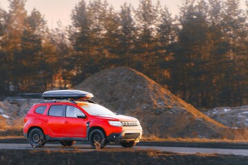Compact red sports car on an open stretch of road