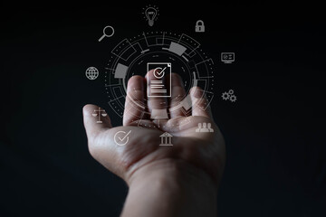 Businessman holding verified document icon in futuristic interface. Compliance and regulations.