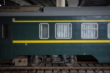 Close-up of China's Vintage Green Passenger Train Carriage