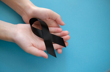Black symbolic ribbon - Mourning and memory of events at the Virgin Polytechnic Institute. Melanoma problem