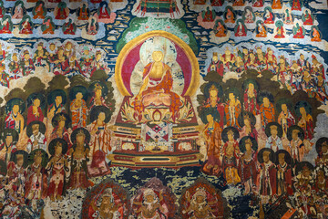 Masterpiece of traditional painting art about Buddha story on the temple wall in Lijiang , China.