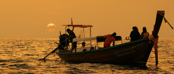 Romantic Sunset with Longtail Boat at Phi Phi Islands, Thailand