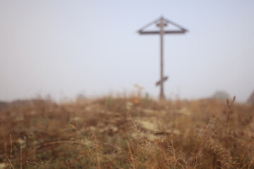 old wooden cross of worship in the Arkhangelsk region Orthodox shrine, landscape of the Russian north