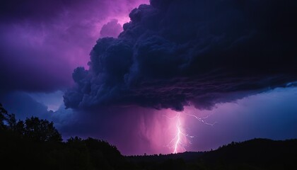 Dramatic purple lightning storm over silhouetted hills